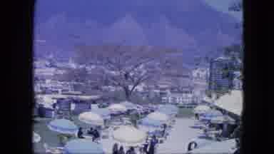 Venezula (1964): Looking Down On A Social Gather With People Dressed In Suits And