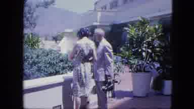Venezula (1964): Two People In Front Of A Hotel With Garden Are Surprised And Turn