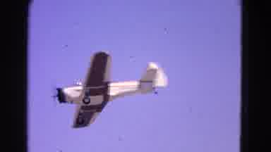 Washington DC-1964: An Old School Airplane Flying Through The Air At A Very High