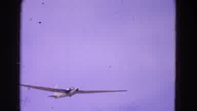 Washington DC (1964): Classic Racing Glider Sweeps Across The Cloudy Sky Above The