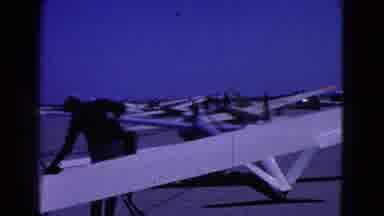 Washington DC-1964: Man Inspects Gliders On Airfield