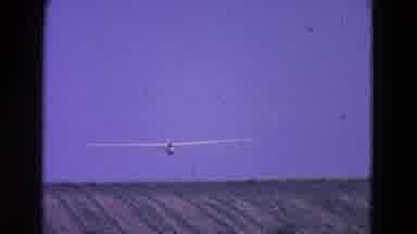 Washington DC-1964: Glider Plane Hovers Over Rural Fields On A Sunny Day