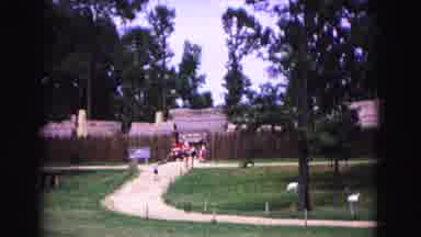 Williamsburg Virginia USA (1964): Crowd Comes Out Of A Fence In The Distance After