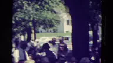 Clarkson Nebraska (1965): People Congregate Together Outside On A Lawn Outside A