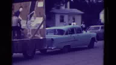 Clarkson Nebraska (1965): Vintage Car Pulling Parade Float Through The Streets In