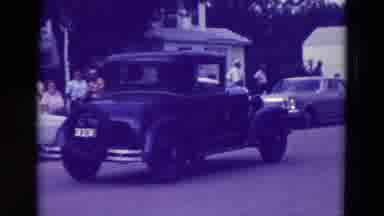 Clarkson Nebraska (1965): Cars Stroll On A Quiet Street On A Low Commercial Day In