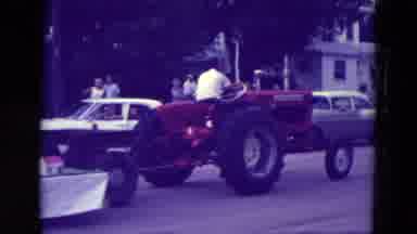 Clarkson Nebraska (1965): Red Tractor Pulls One By Land Two By Sea Float In Parade