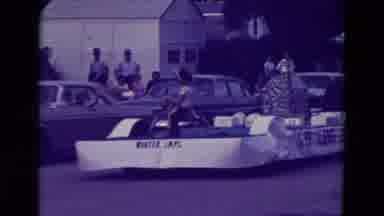 Clarkson Nebraska (1965): A Rocket Ship Float Gets Towed Through Town In A Parade