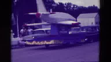 Clarkson Nebraska (1965): A Plane And Red White And Blue Float Being Pulled By