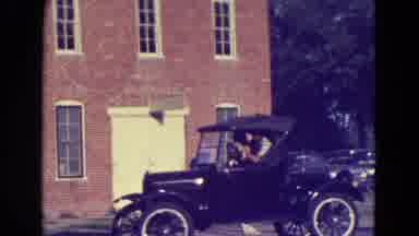 Diller Nebraska (1965): Old Cars Are Driven Down The Street By Happy People