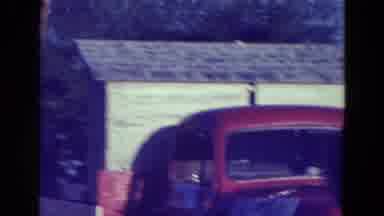 Diller Nebraska (1965): Man Idles Back And Forth On Float During A Small Town