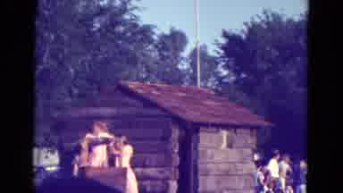 Diller Nebraska (1965): Band Members On Truck During A Parade Down Street And Log