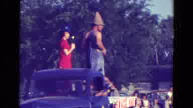 Diller Nebraska (1965): Truck Parade With Woman In A Red Dress Men In Pointy Hats