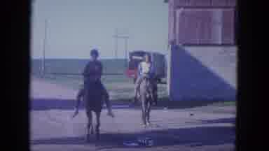 Louisville Kentucky USA (1965): Two Ladies In Front Of Building Ride Horses Toward