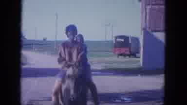 Louisville Kentucky USA (1965): Women Ride Horses As Ducks Wander Through The Farm