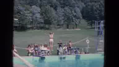 Manchester New Hampshire (1965): Onlookers Watch As A Woman Prepares To Dive Into