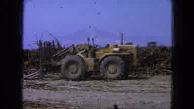 Pueblo Mexico (1965): Large Tractor With Front Loader Tines Lifting Up In Flat