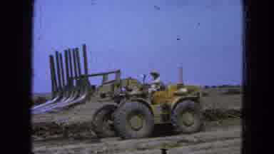Pueblo Mexico (1965): Man Working On Road Opening With Backhoe On Cloudy Day