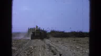 Pueblo Mexico (1965): Man Driving Bulldozer Clearing Debris And Brush From Empty