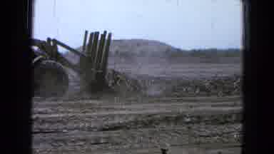 Pueblo Mexico (1965): Person Operating Machinery To Plow And Clear Logs From Dirty