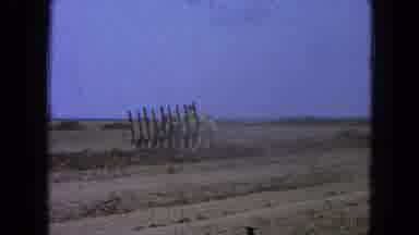 Pueblo Mexico (1965): A Farming Equipment Vehicle Working In A Barren Dirt Field