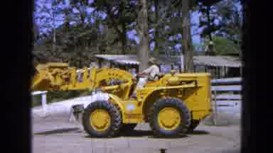 Pueblo Mexico (1965): Tractor Lifting With Trees Nearby