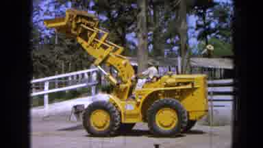 Pueblo Mexico (1965): An Operator Lowers The Bucket Of A Front End Loader In Front