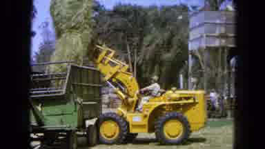 Pueblo Mexico (1965): Loader Carrying Dry Grass To The Trailer To Food Animals