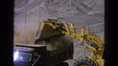 Pueblo Mexico (1965): A Machine Dumping Dirt In An Truck