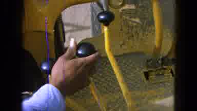 Pueblo Mexico (1965): A Man With Blue Shirt Working On A Machine