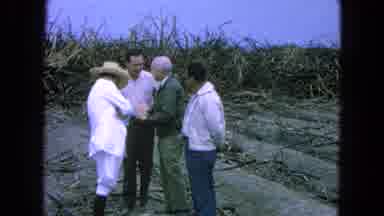 Pueblo Mexico (1965): Four White Men Standing Near Each Other On A Plantation