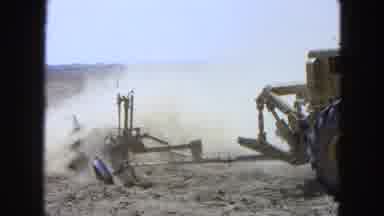 Pueblo Mexico (1965): A Big Tractor Plowing Dirt In A Field With Flat Landscape In