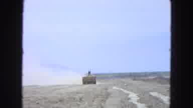Pueblo Mexico (1965): Farmer On A Tractor Tilling Dry Arid Land While Dust Flies