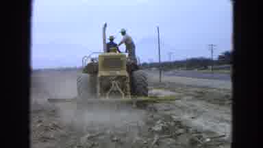 Pueblo Mexico (1965): Man On A Yellow Tractor Discing A Large Field Getting Ready