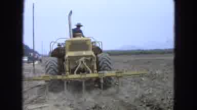 Pueblo Mexico (1965): Farmer In A Yellow Tractor Lays Top Soil On To His Field