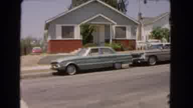 Barstow California USA (1966): Random Scene Where Are Two Cars In A Street In