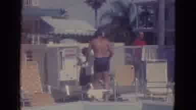 Busche Gardens Florida (1966): Man Gets His Towel From A Lady Beside The Sun