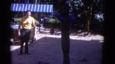 Busche Gardens Florida (1966): Man Tries To Get Close To Two Blue Parrots Feeding