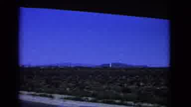 California USA (1966): Passing Desert Looking Landscape With Hills Off In The