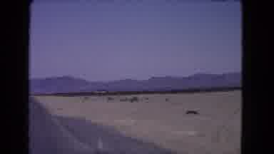 California USA (1966): View Of The Desert From The Window Of A Moving Car Showing
