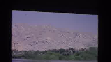 California USA (1966): A View Of A Mountain Range Through The Back Of A Car On A