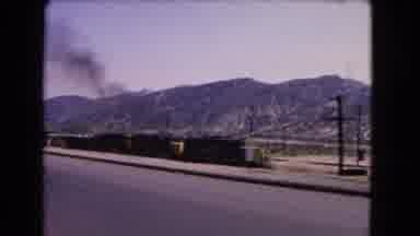California USA (1966): Road Trip Through The Mountains Alongside Railway On A