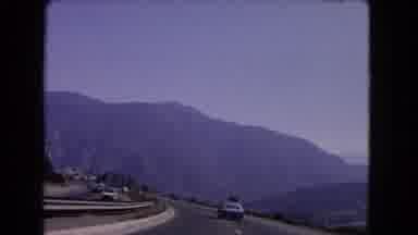 California USA (1966): Mountain Car Road Dashcam Old Signs Nature Plants White Sky