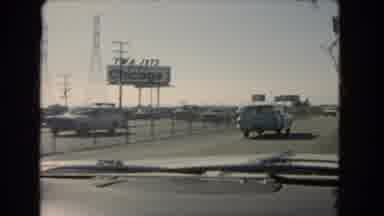 California USA (1966): Film Taken From Moving Vehicle Driving By Billboard That