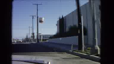 California USA (1966): Car Films And Drives Past Various Unmarked Buildings On The