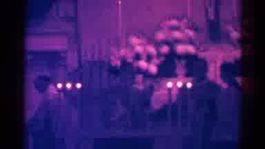 Danville Illinois (1966): Candles Lit Underneath A Hanging Display Of Jesus Christ