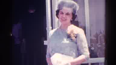 Danville Illinois (1966): Woman In Formal Attire Greeting People Entering A
