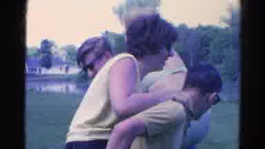 Danville Illinois (1966): Some People Giving Piggyback Rides In A Tropical Setting