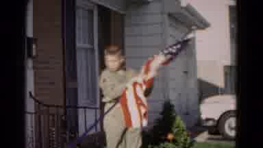 Hagerstown Maryland USA (1966): A Teenage Boy Coming Out Of His Him Home Holding A