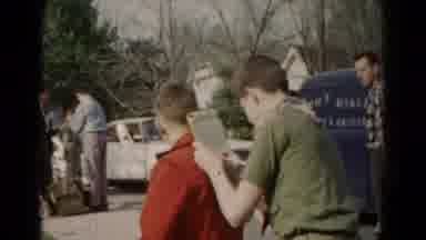 Hagerstown Maryland USA (1966): Boy Scout Writing On Notepad While Using A Friend